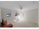 Bedroom with neutral walls and carpet, ceiling fan, and natural light from the window at 2040 Touchwood Ct, Apopka, FL 32712