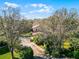 Aerial view of a two-story home surrounded by mature trees and lush landscaping at 2040 Touchwood Ct, Apopka, FL 32712