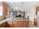 Bright, open kitchen featuring granite countertops and views into the living room at 2040 Touchwood Ct, Apopka, FL 32712