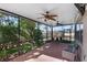 Screened-in porch with ceiling fans offers a relaxing outdoor living space at 2040 Touchwood Ct, Apopka, FL 32712