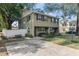 Inviting two-story townhome showcases mature trees and well-manicured landscaping at 210 N East St, Maitland, FL 32751