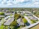 An aerial view shows the property in a neighborhood with mature trees, offering privacy at 225 Ranier Cv # 105, Casselberry, FL 32707