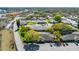 An aerial view showcases the property and the surrounding neighborhood with mature trees at 225 Ranier Cv # 105, Casselberry, FL 32707