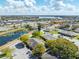 An aerial view of the community shows a small pond, and nearby shopping and restaurants at 225 Ranier Cv # 105, Casselberry, FL 32707