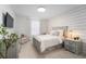 Bright bedroom featuring a plank accent wall, gray furnishings, and lots of natural light at 2273 Lost Horizon Way, Clermont, FL 34715