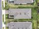 Overhead view of neighborhood homes with manicured lawns, paver driveways, and carefully designed landscaping at 2348 Clemblue Rd, Clermont, FL 34715