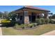 Community mail kiosk featuring stacked stone detail surrounded by lush landscaping at 2348 Clemblue Rd, Clermont, FL 34715