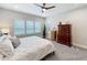 Spacious main bedroom featuring plantation shutters, modern decor, and ample natural light at 2348 Clemblue Rd, Clermont, FL 34715