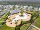 Aerial view of a community pool, clubhouse, playground, and common space at 2930 Wordsmith Rd, Kissimmee, FL 34746