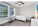 Bedroom with wood flooring, ceiling fan, and natural light at 2930 Wordsmith Rd, Kissimmee, FL 34746