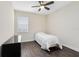 Bedroom with wood flooring, ceiling fan, and natural light at 2930 Wordsmith Rd, Kissimmee, FL 34746