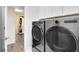 The laundry room features gray front loading washer and dryer at 2930 Wordsmith Rd, Kissimmee, FL 34746