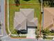 An aerial view of a home's roof and property lines, showcasing its location on a corner lot at 3000 Stonington Run, Kissimmee, FL 34746