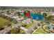 Aerial view of home and community with a lake and blue playground at 3000 Stonington Run, Kissimmee, FL 34746