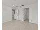 Bright bedroom with wood floors, white trim, and a walk-in closet at 3000 Stonington Run, Kissimmee, FL 34746