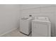 Laundry room with washer, dryer, and wire shelving at 3000 Stonington Run, Kissimmee, FL 34746