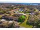 Aerial view of the neighborhood highlighting the home, landscaping, and proximity to the lake at 30113 Robin Ln, Tavares, FL 32778