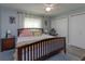 Cozy bedroom featuring wood floors, a comfortable bed, and neutral wall paint, creating a serene atmosphere at 30113 Robin Ln, Tavares, FL 32778