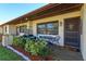 Inviting front porch with seating area and decorative plants creating a cozy entrance at 30113 Robin Ln, Tavares, FL 32778