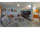 Bright and airy living room featuring luxury vinyl plank flooring, ceiling fan, and lots of natural light at 30113 Robin Ln, Tavares, FL 32778