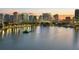 Scenic city skyline reflecting in calm lake waters at dusk, showcasing illuminated buildings at 303 S Forest Ave, Orlando, FL 32803