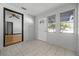 Inviting entryway featuring tile floors, natural light from multiple windows, and a clear view to the home's interior at 303 S Forest Ave, Orlando, FL 32803