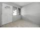 Bright entryway with tiled floor, fresh paint, and a clear, welcoming view to the home’s exterior at 303 S Forest Ave, Orlando, FL 32803