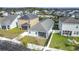 Aerial view of a backyard featuring a screened-in porch and a white picket fence at 3088 Prelude Ln, Kissimmee, FL 34746