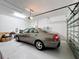 Spacious garage with a car parked inside, and an automatic door at 3088 Prelude Ln, Kissimmee, FL 34746