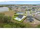 Aerial view of a home with a backyard pool and metal fence outlined in yellow at 3135 Vanguard Ct, St Cloud, FL 34771