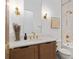 Elegant bathroom with a marble-tiled shower, white countertop, and brass fixtures offering a spa-like experience at 3135 Vanguard Ct, St Cloud, FL 34771