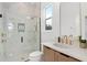 Modern bathroom featuring a glass-enclosed shower, marble walls, and sleek fixtures at 3135 Vanguard Ct, St Cloud, FL 34771