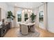 Bright dining room featuring modern light fixture, natural light, and contemporary decor at 3135 Vanguard Ct, St Cloud, FL 34771