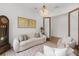 Bright living room with plush seating, decorative rug, and a view of a modern doorway at 3135 Vanguard Ct, St Cloud, FL 34771