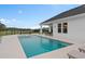 Sparkling pool and spa with a dining area and covered patio create an ideal outdoor oasis for entertaining at 3135 Vanguard Ct, St Cloud, FL 34771