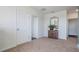 Neutral hallway with carpet flooring, and decorative cabinet with mirror above at 3166 Partington Blvd, Davenport, FL 33837