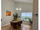 Cozy dining room area featuring pendant lighting and a large window with garden views at 3210 Little Oak Way, Orlando, FL 32812