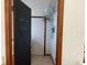 Hallway with chalkboard door and shelving, adding character and functionality at 3210 Little Oak Way, Orlando, FL 32812