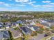 Aerial view showcasing the property, surrounding neighborhood, and mature trees at 3320 Ashmount Dr, Orlando, FL 32828