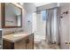 Bathroom with a single sink vanity and a shower-tub combo at 3320 Ashmount Dr, Orlando, FL 32828