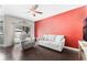 Living room featuring a gray sofa, chair, and hardwood flooring at 3320 Ashmount Dr, Orlando, FL 32828