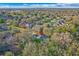 Beautiful aerial shot of a home surrounded by mature trees and well-maintained neighborhood streets at 3443 Players Point Loop, Apopka, FL 32712