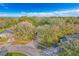 Aerial view of home showcasing its location on a quiet street with mature trees and well-maintained landscaping at 3443 Players Point Loop, Apopka, FL 32712