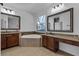 An elegant bathroom with and sinks and a large bathtub at 3443 Players Point Loop, Apopka, FL 32712