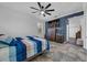 Comfortable bedroom with tile floors, a ceiling fan, and a mounted TV at 3443 Players Point Loop, Apopka, FL 32712