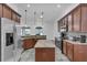 Kitchen features stainless steel appliances, center island, and granite countertops at 3443 Players Point Loop, Apopka, FL 32712