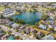 Aerial view of homes located on a lake in a developed residential neighborhood at 3722 Madbury Cir, Lakeland, FL 33810