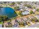 A high aerial view displays the backs of homes bordering a lake in a residential neighborhood at 3722 Madbury Cir, Lakeland, FL 33810