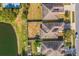 Aerial view of homes located next to a tranquil lake in a quiet neighborhood at 3722 Madbury Cir, Lakeland, FL 33810