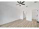 Bedroom featuring a ceiling fan, wood-look floors, and ensuite bathroom and walk-in closet at 3722 Madbury Cir, Lakeland, FL 33810